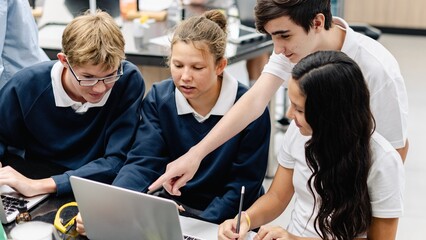 Fototapete - Diverse group of students collaborate in science lab. Diverse students, teamwork, and learning in school classroom. Diverse students collaborate in science class, teamwork group project at school