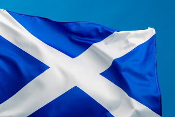 Wall Mural - Scottish flag waving on blue background