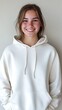 © Andrii Gatchenko - Teenage girl with a casual hoodie natural smile plain beige background professional and casual ID photo