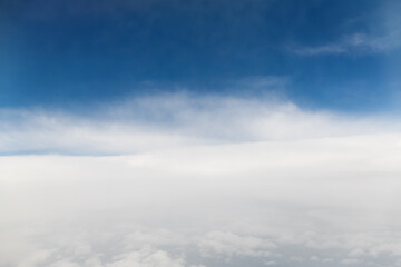 Wall Mural - looking at the clouds and sky on the plane