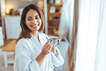 Wall Mural - Relaxed Woman Enjoying Morning Coffee in Cozy Home Setting