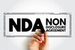 © dizain - NDA Non-Disclosure Agreement - legal contract between two parties that outlines confidential material, acronym text stamp