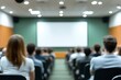 © Imagentive - Blurry Audience at Presentation in Large Room