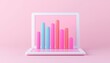 © CHONCHANOK PHOTO - Stylish laptop displaying colorful bar graphs on a pink background, ideal for modern business and data visualization.