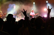 © xy - People hands making rock gesture at the concert