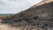 © Oleh Marchak - Charred landscape reveals the aftermath of a fire in a dry environment