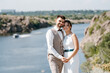 © omelnickiy - bride blonde girl and groom near the river
