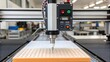 © DigitalSpace - A medium closeup of an advanced dispensing machine with adhesive being applied in precise beads onto a substrate within a manufacturing setup.