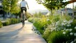 © Tana Studio - Biker Riding Through Scenic Pathway Surrounded by Blooming Flowers and Greenery