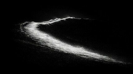 a monochrome image captures the silhouette of a wave in the moonlit ocean, illuminated by celestial 
