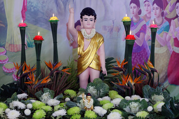 Wall Mural - Thien Quang buddhist pagoda.  Infant Buddha statue pointing the north. On Vesak Day, Buddhists  commemorates: the birth, enlightenment and the death of Buddha Gautama. Tan Chau. Vietnam.