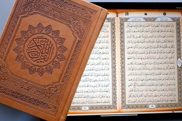 Wall Mural - Islam. Religious text. The Quran consists of over 6000 verses organized in 114 capters, so called Surahs. Paper and digital quran.