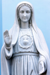 Wall Mural - Basilica of Our Lady of La Vang. Statue depicting the Immaculate Heart of Mary as described by Sister Lucia, the famous visionary of Fatima. Virgin Mary.  Marble statue.  Vietnam.