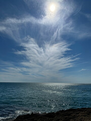 Wall Mural - sun sky clouds sea coast.