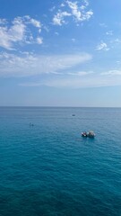 Poster - Serene seascape with boats on clear blue water.