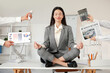 © Pixel-Shot - Young businesswoman with newspaper, calculator, telephone and charts meditating on table in modern office