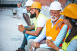 © Dragana Gordic - Construction Workers Enjoying a Friendly Break at the Job Site