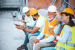 © Dragana Gordic - Construction Workers Enjoying a Coffee Break Together at Job Site Outdoors