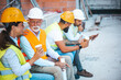 © Dragana Gordic - Construction Workers Enjoying a Break With Coffee and Conversation
