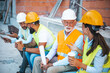 © Dragana Gordic - Construction Team Taking a Break, Discussing Over Drinks at the Building Site