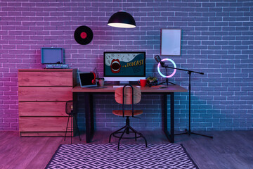 Sticker - Interior of dark studio with podcaster's workplace, commode and glowing lamp