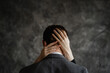© Aleksandra Gritsenko - Woman's hands in man's hair captured on textured gray background