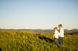 © Caseyjadew - Little boys walking together along hilltop with vast scenic views