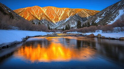 Wall Mural - sunset reflecting on a snow-covered river with mountains in the background.