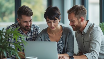 Wall Mural - Three young professionals, two men and one woman, are engaged in a lively discussion while working on a laptop in a bright, contemporary office. Their expressions reflect enthusiasm and camaraderie