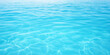© NaphakStudio - Crystal clear turquoise water with gentle ripples reflecting light.