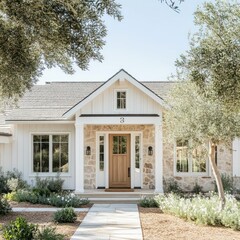 Wall Mural - charming modern farmhouse with white siding, metal roof, landscaped garden, wooden door, natural surroundings, and inviting rustic architectural design.