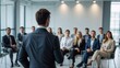 © VistaVisions - Confident businessman giving a presentation in front of crowd in meeting conference seminar room. Leadership authority teamwork in business concept