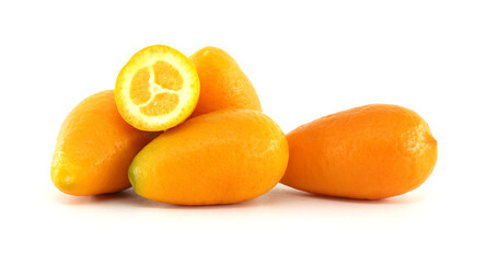 Wall Mural - Fresh kumquats showing pulp on white background