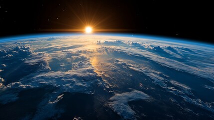 Wall Mural - a view of the sun rising over the earth from space