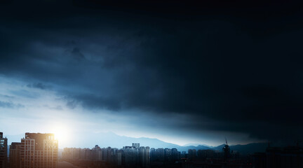 Wall Mural - city buildings under the storm clouds