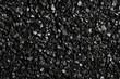 © DnQajik - Black background with small particles of sand or dust for a design template, print, and texture