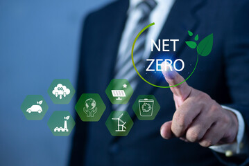 Businessman touching Net Zero icon. natural environment A climate-neutral long-term strategy greenhouse gas emissions targets. concept of carbon neutral and net zero.