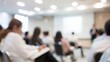© Jo - Leadership Seminar Blur: A blurred setting of a leadership seminar with participants taking notes and interacting with the speaker.