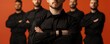 © Wimon - Group of shipping employees in matching black attire, one man standing prominently in the foreground, representing teamwork and service
