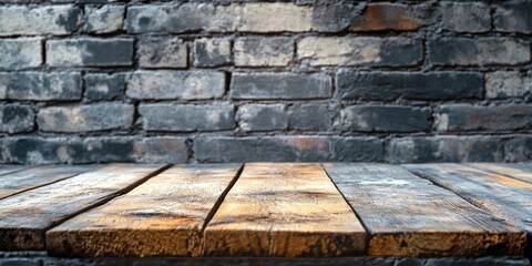 Canvas Print - Wooden tabletop in sharp focus against a textured cinder block wall background, featuring warm browns and grays, ideal for product display.