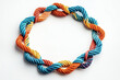 © Tatsiana - Multicolored ropes intertwining to form an octagon symbolizing teamwork and community unity on a clean white backdrop