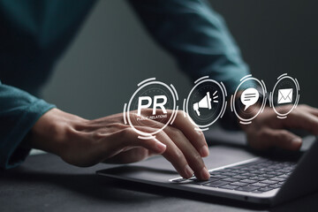 pr, public relations concept. businessman using laptop with public relations icon on virtual screen 