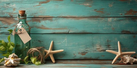 Summer themed marine backdrop with turquoise wood texture, glass bottle with tag, starfish and seashells arranged on wooden table.