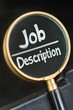 © Steven - Magnifying glass highlighting the words 'Job Description' on a dark background, symbolizing focus on employment details and recruitment.