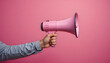 © artmozai - Amplifying the Message: A Pink Megaphone on a Rosy Backdrop