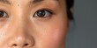 © Evon J - Close-up of young asian female's natural skin texture and brown eye