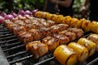 © Mark - At an outdoor party, friends enjoy food cooking on a lively barbecue grill