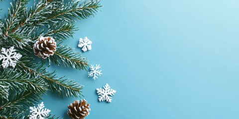 Poster - A festive evergreen Christmas branch adorned with snowflakes is set against a gradient blue background, creating a perfect banner that includes a space for your message.