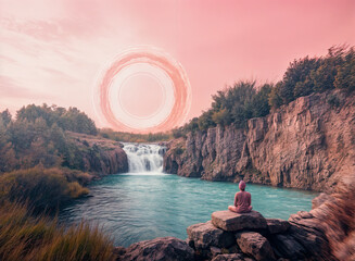 Wall Mural - a serene natural scene with a person sitting on a rock by a cascading waterfall. The water is a beautiful teal color, and the sky is a soft pink hue, creating a tranquil and picturesque atmosphere.