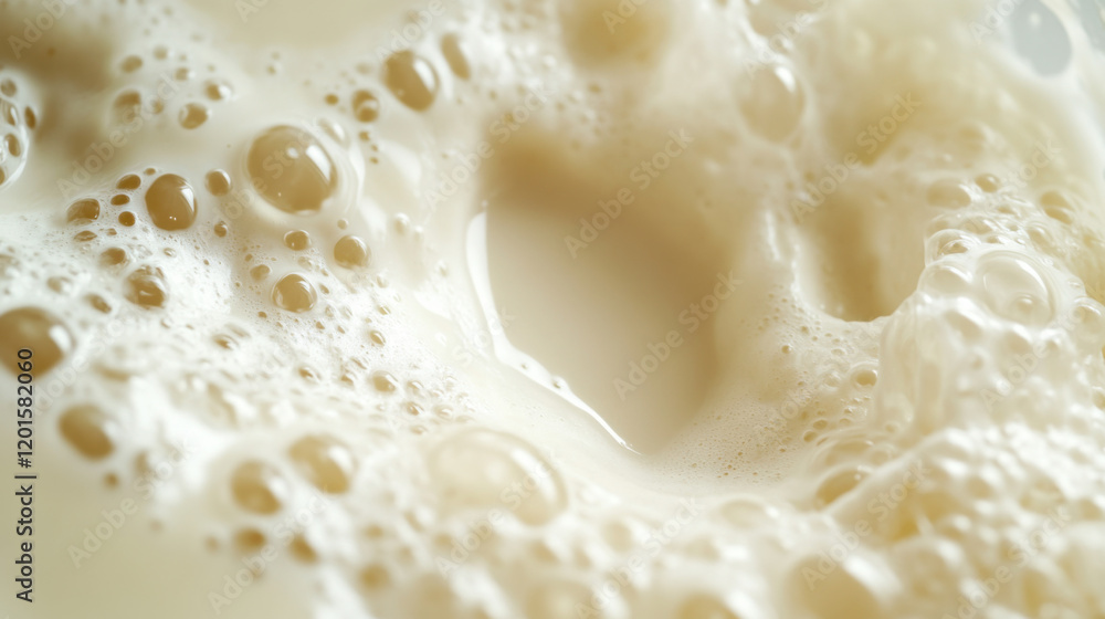 Close-up View of Creamy Milk Foam with Air Bubbles Creating a Rich Texture in a Gentle Whirlpool, Evoking Freshness and Culinary Artistry for Food Photography